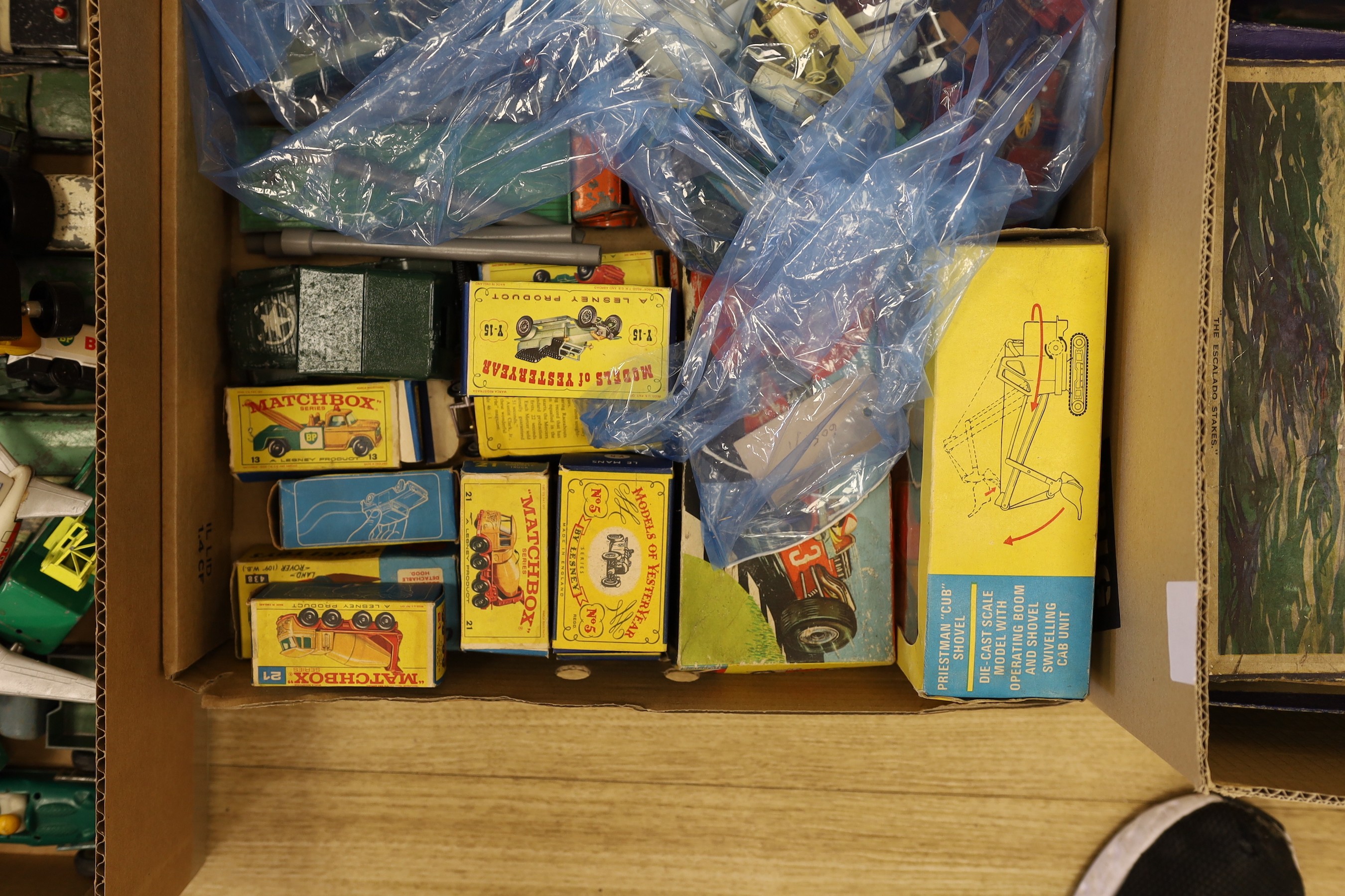 A collection of die-cast toys and boxed games